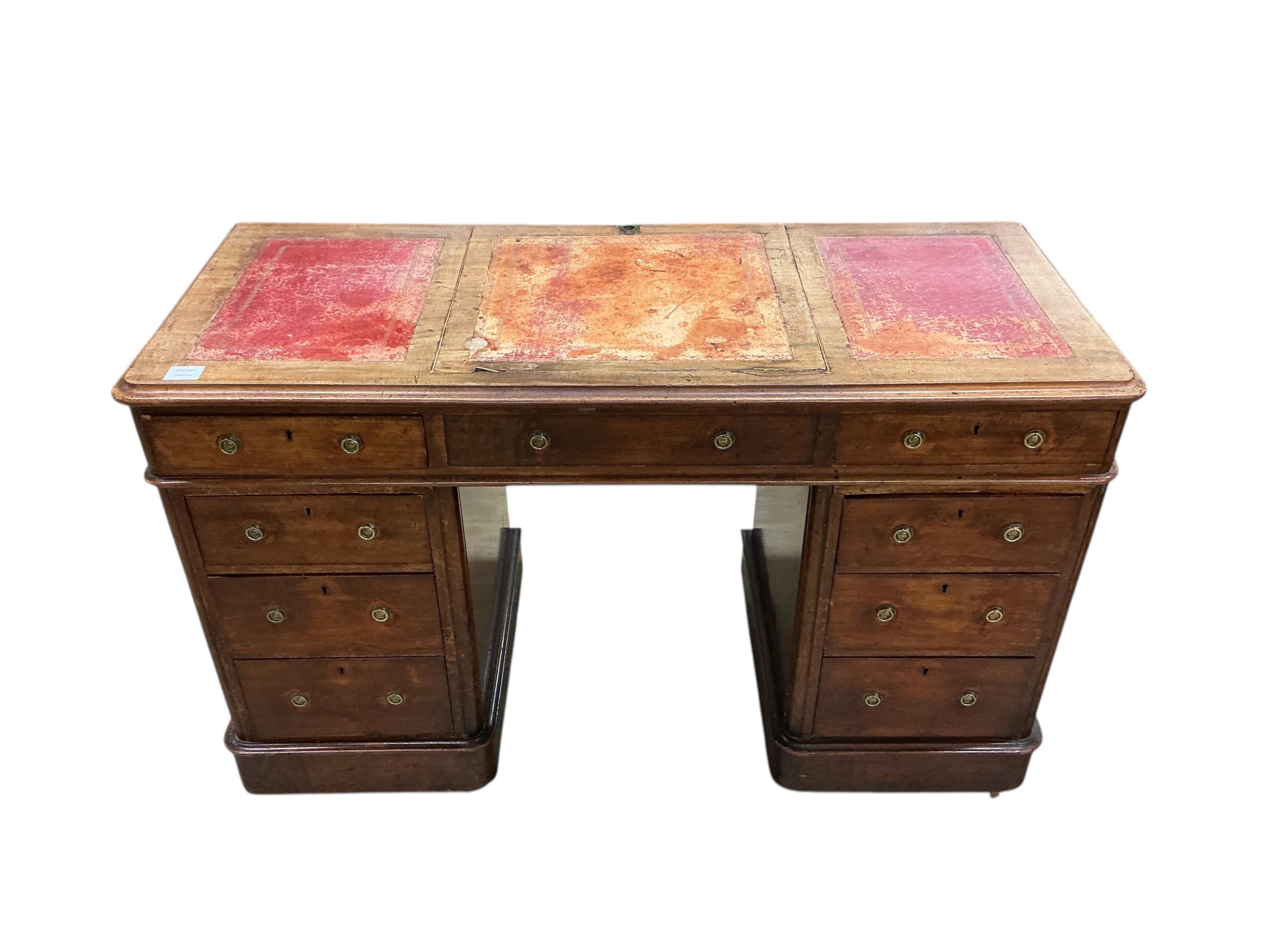 A Victorian mahogany pedestal desk, the top with hinged central section, width 122cm, depth 53cm, height 78cm